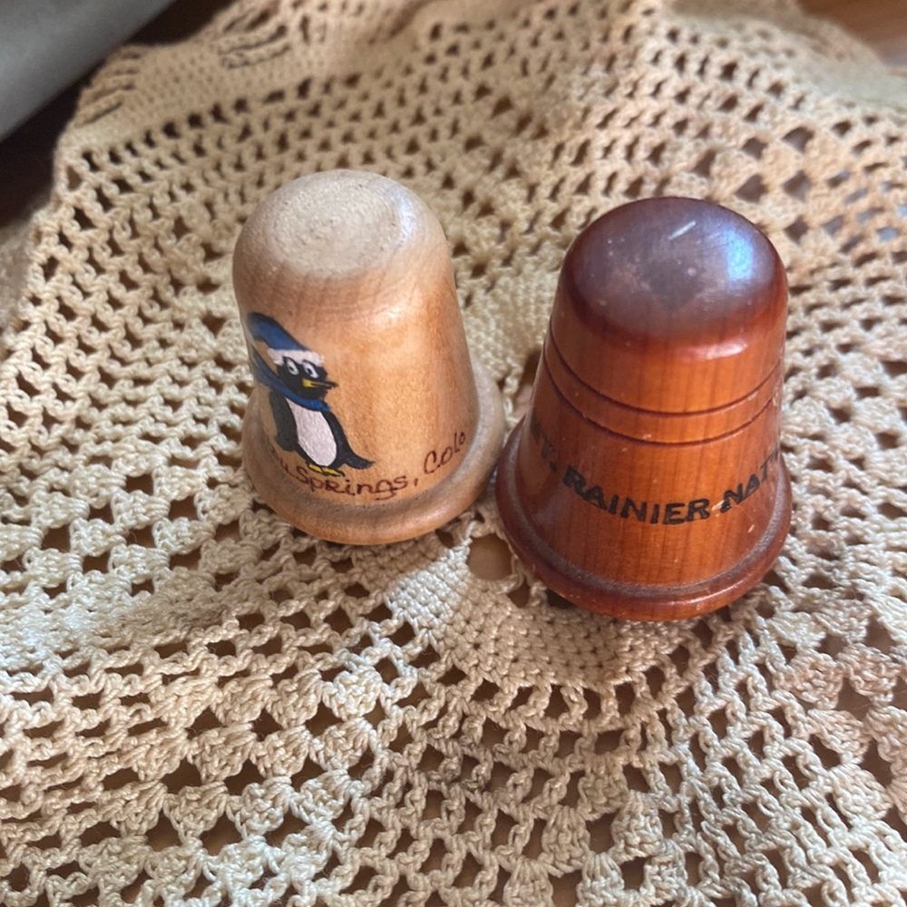 Two collectible wooden thimbles